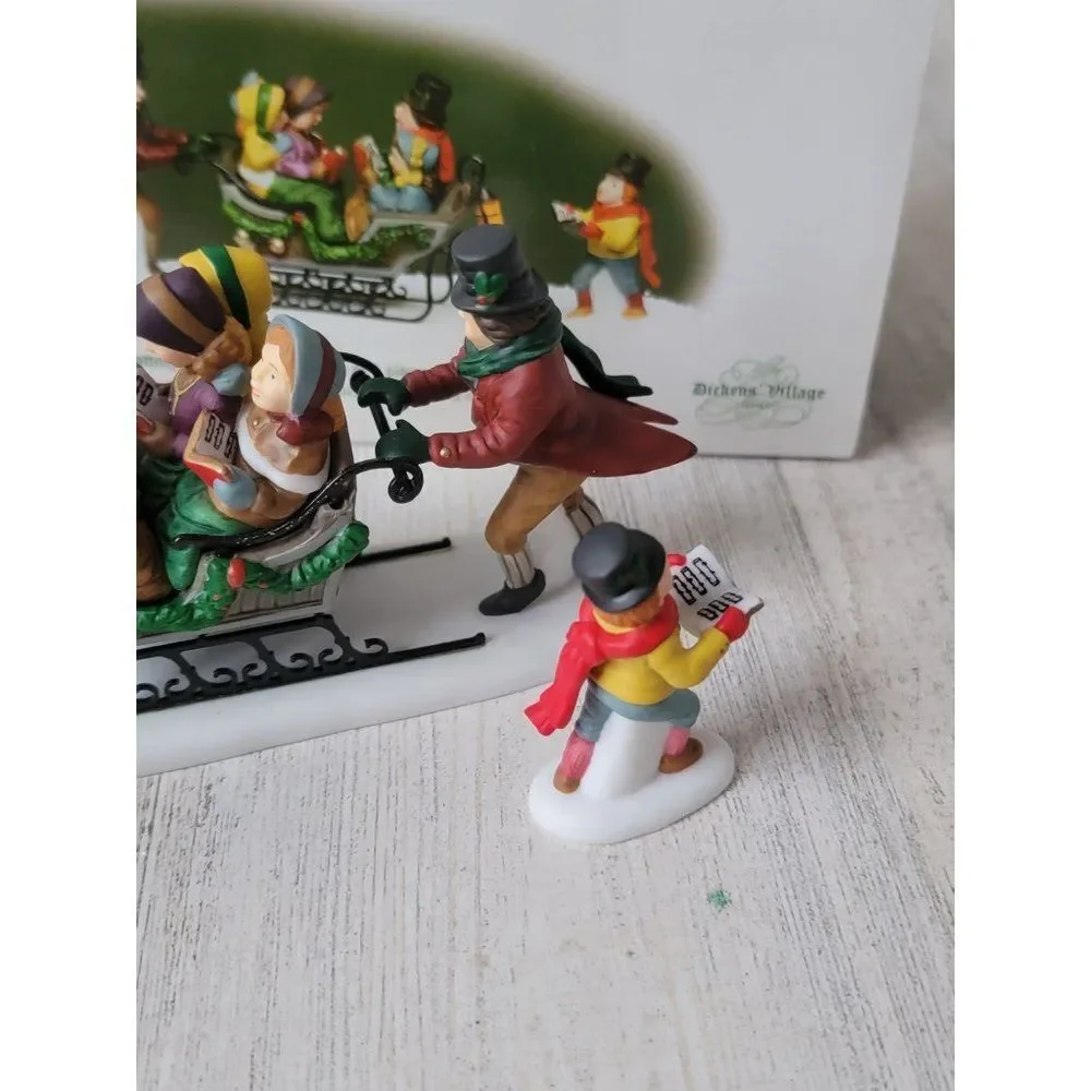 Dept 56 58396 Caroling With The Cratchit Family (Revisited) village accessory xm